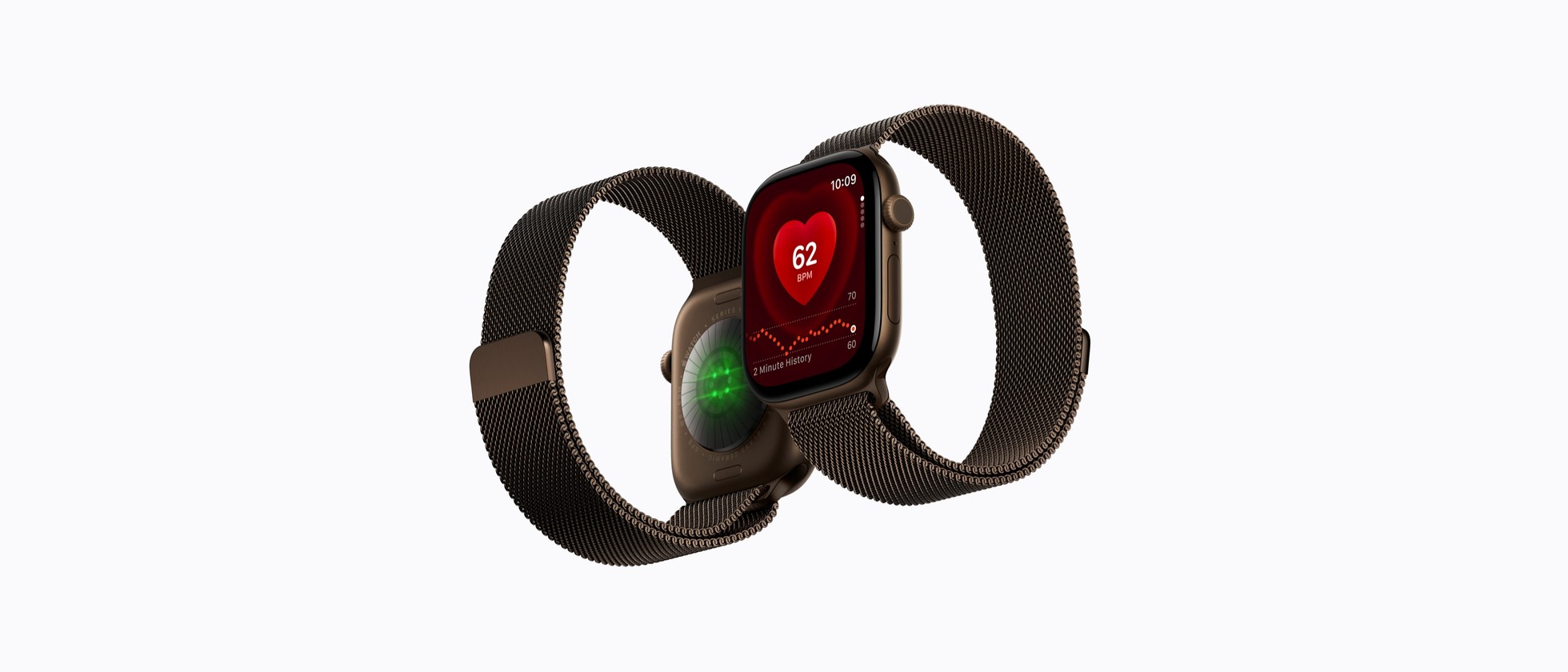 Dvoje Apple Watch Series 12 s milánským tahem a zobrazenou tepovou frekvencí
