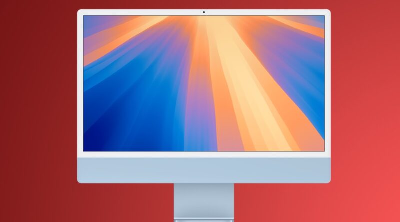 Modrý iMac na červeném pozadí