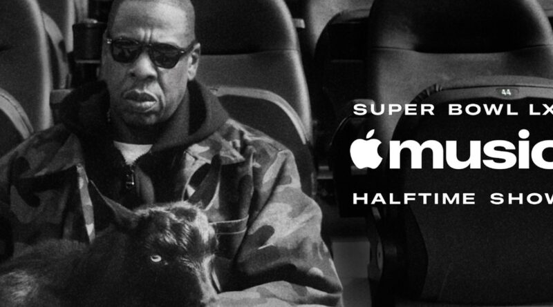 JAY-Z v hledišti stadionu vedle loga Apple Music Super Bowl LXI Halftime Show