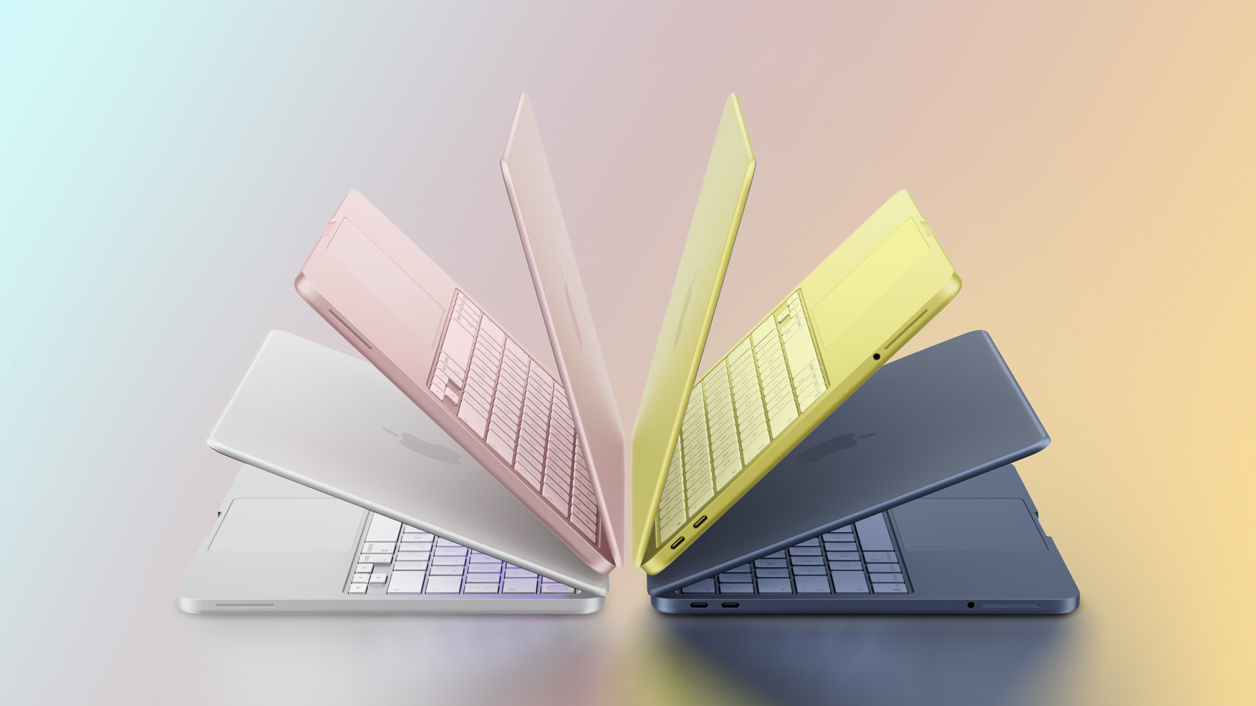 Čtyři barevné varianty MacBooku Neo vyskládané vedle sebe